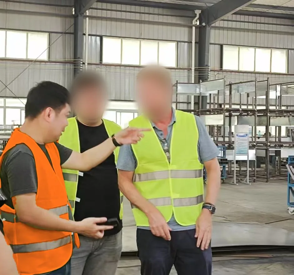 Vorienta explaining a customer's requirements to a manufacturer on the factory floor